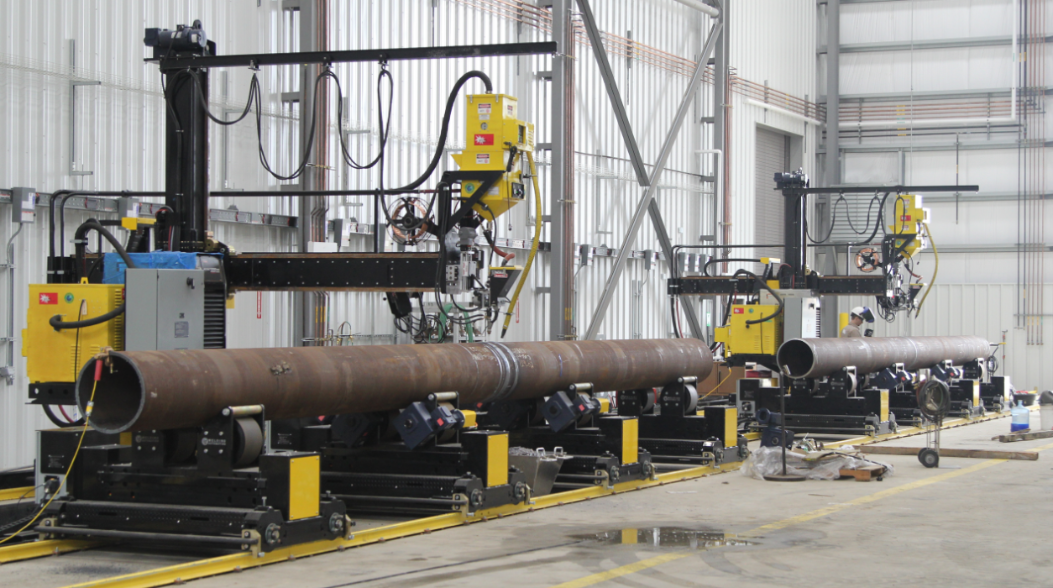 column and boom welding manipulators with pipe growing line system