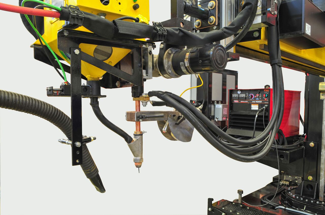 flux feed and recovery systems for welding manipulators