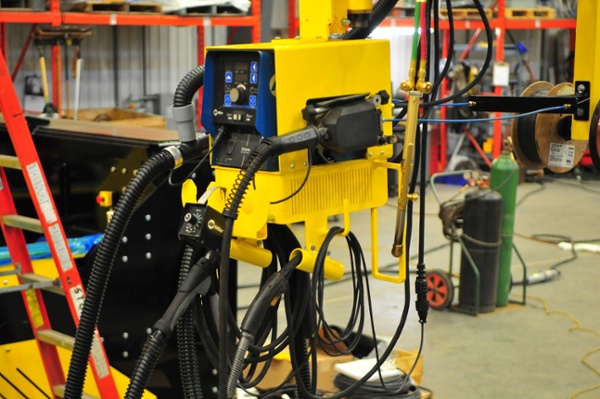 MIG welding boom mount power supply